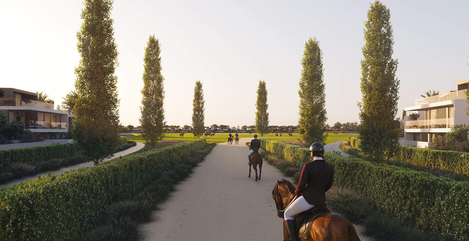 Riders on horseback on a tree-lined path through the community